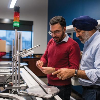 Rupy Sawhney in the Factory Floor Lab with a Student