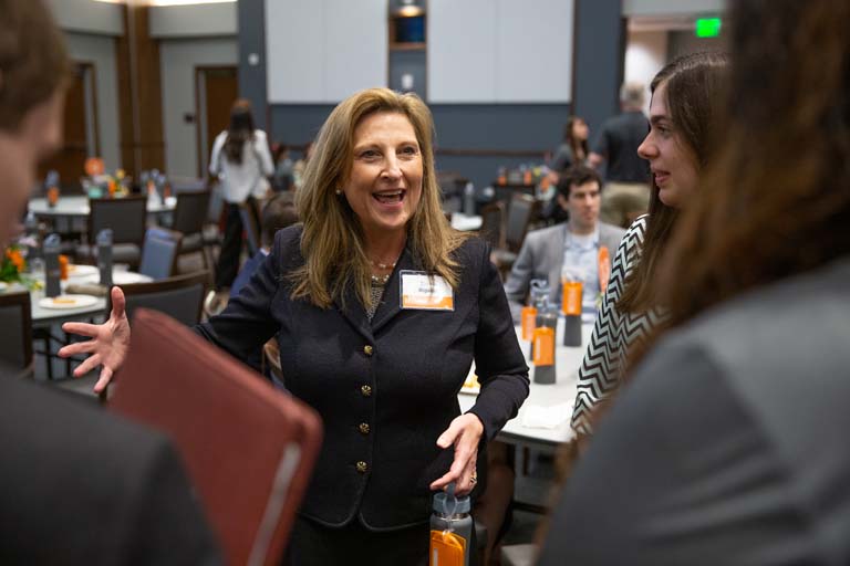 Barbie Bigelow, keynote speaker for the event, networks with students during WomEngineers Day.