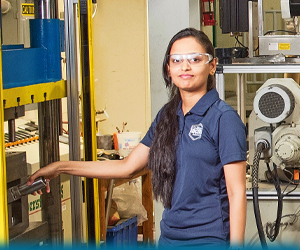 A Grad Student works in the Fibers and Composites Manufacturing Facility