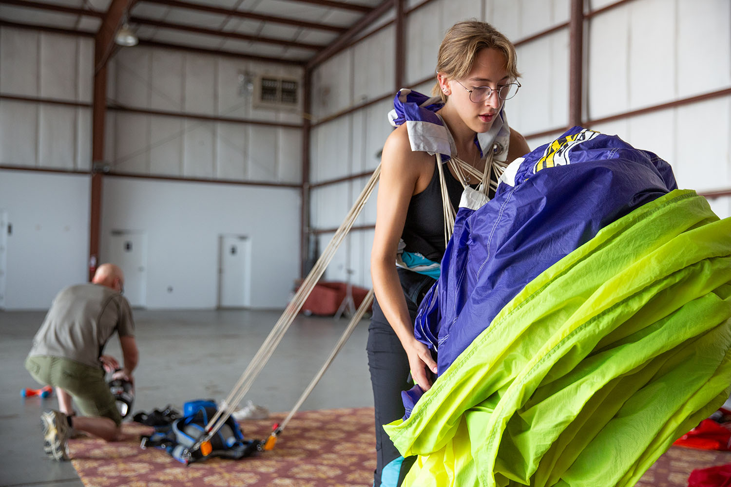 Dana Bjorn packs parachute.