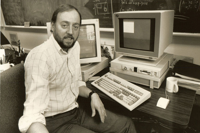 Dongarra working with an IBM PC and Sun Microsystems Workstation