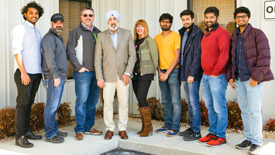 Professor Rupy Sawhney standing with a student group