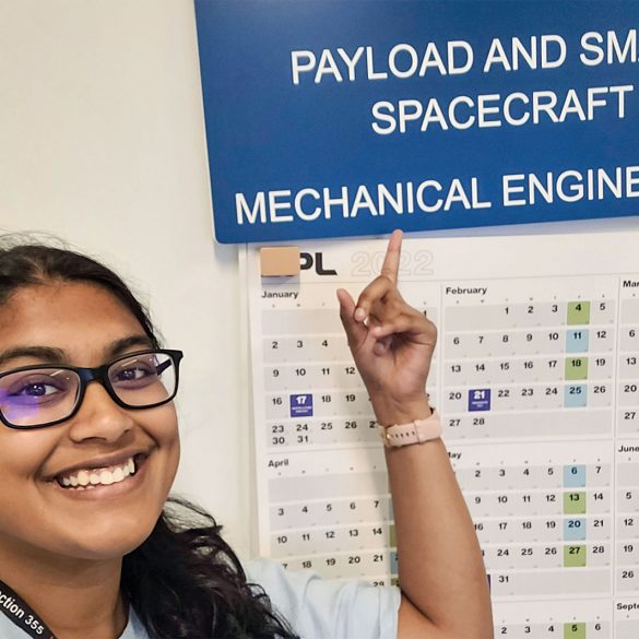 Sreya Kumpatia pointing to a chart with the heading "Payload and Small Spacecraft"