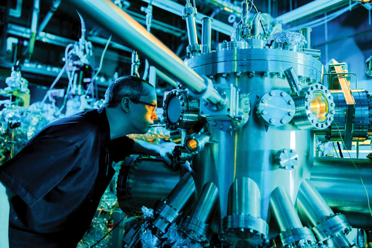A graduate student works in the Molecular Beam Epitaxy Core Facility