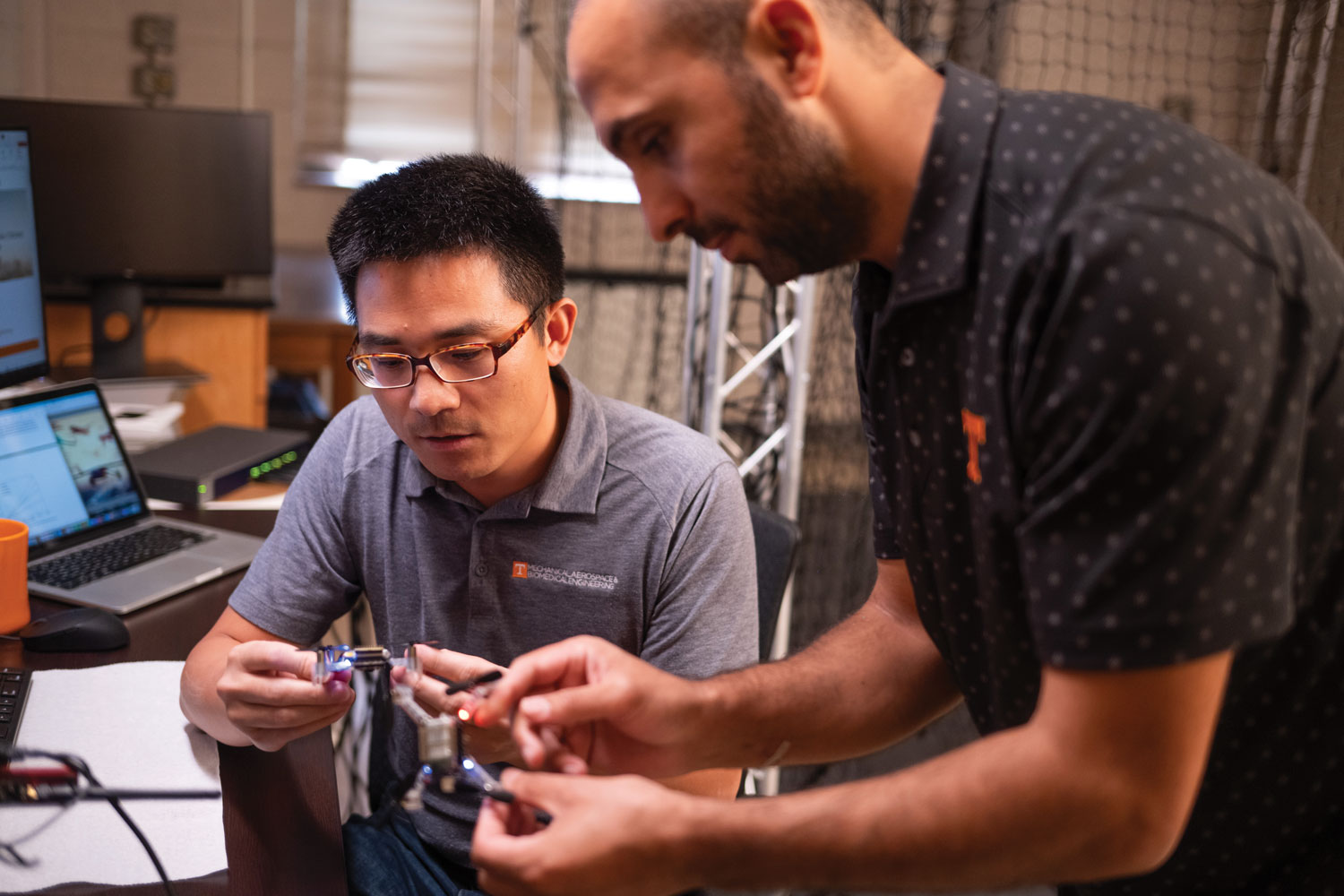 Assistant Professor Zhenbo Wang working with a drone