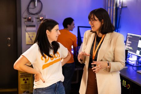 Assistant Professor Sandra Bogetic helps graduate and undergraduate students working in the control room during an experiment with the fast neutron source in Zeanah Engineering Complex