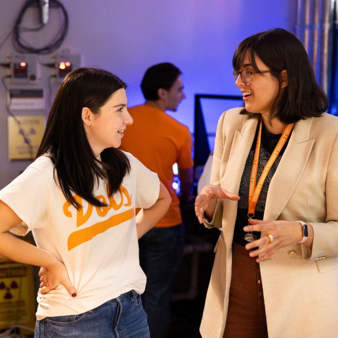 Assistant Professor Sandra Bogetic helps graduate and undergraduate students working in the control room during an experiment with the fast neutron source in Zeanah Engineering Complex