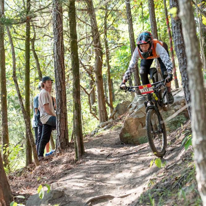 Avah Cherry riding her mountain bike