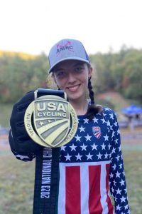 Avah Cherry showing her USA cycling medal