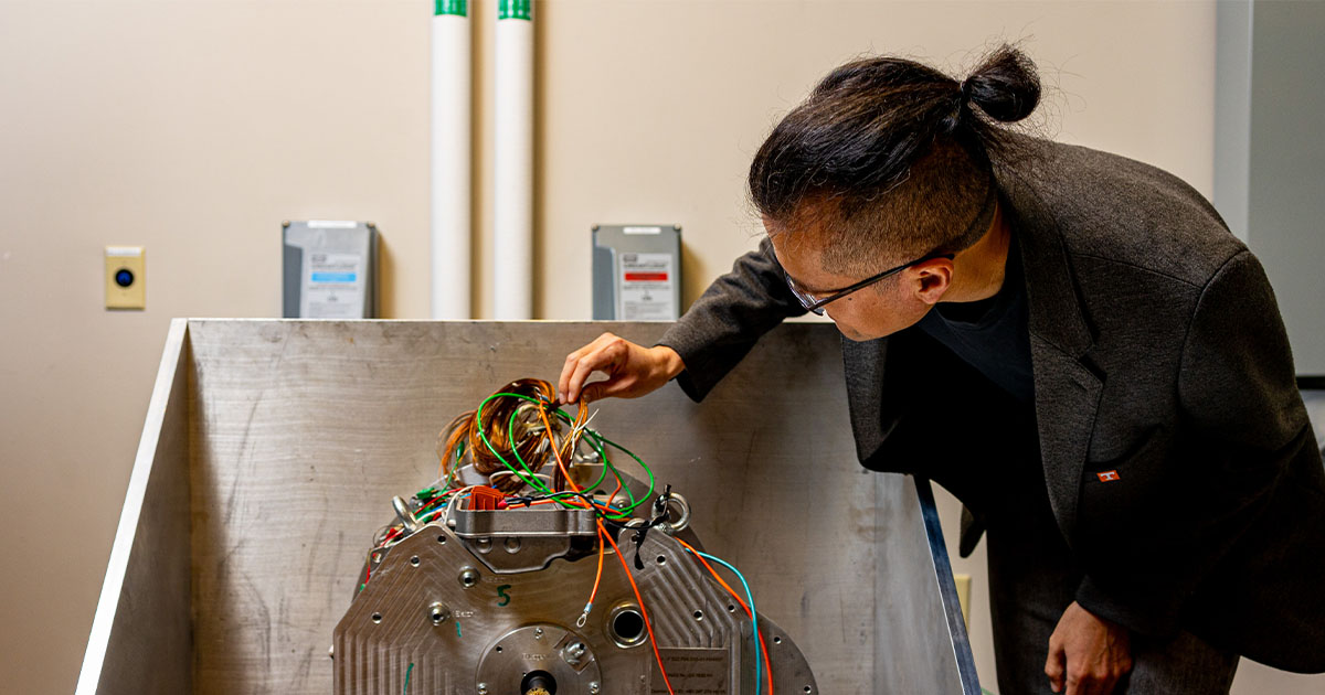 Kevan Bai taking a look at his compact drive inverter.