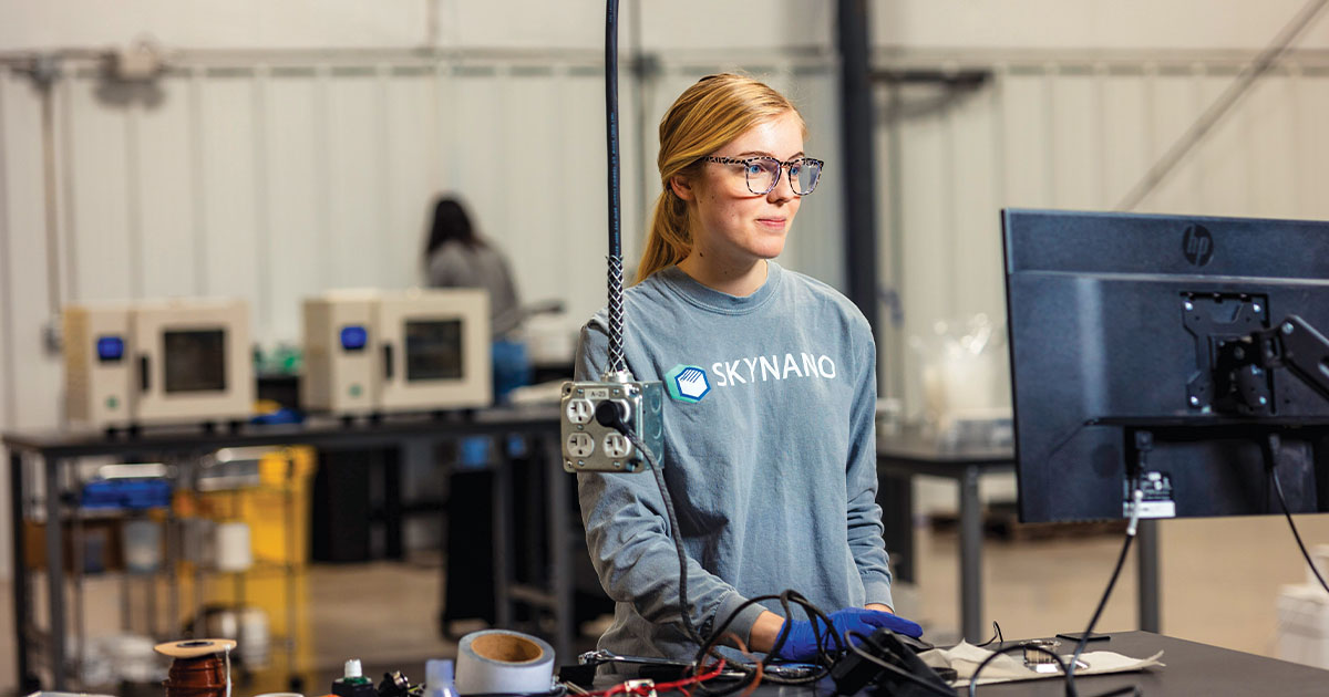 Lucy Moore working at her desk at the Center for Materials Processing.