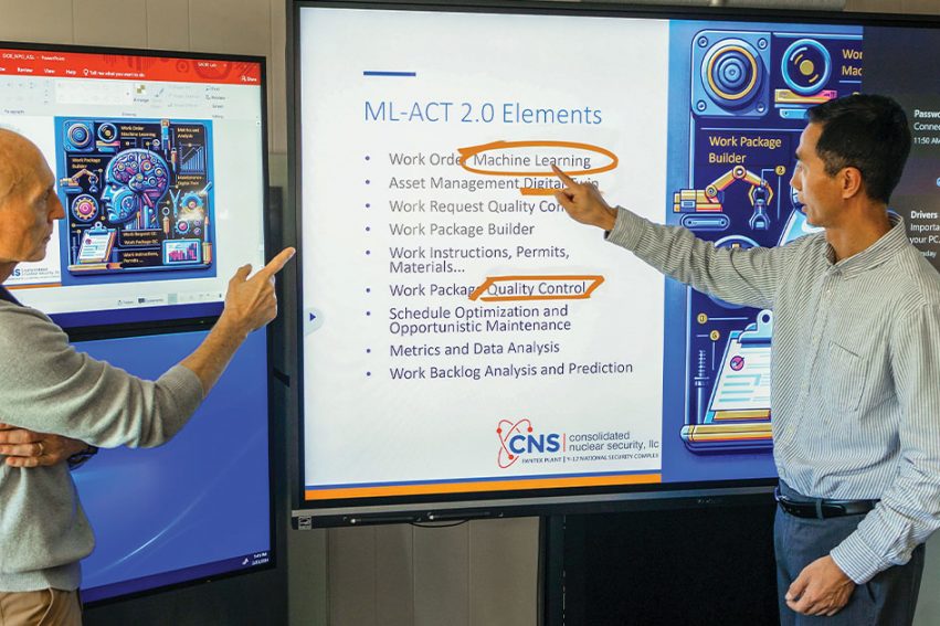 Tom Berg and Xueping Li look over a project slide together.