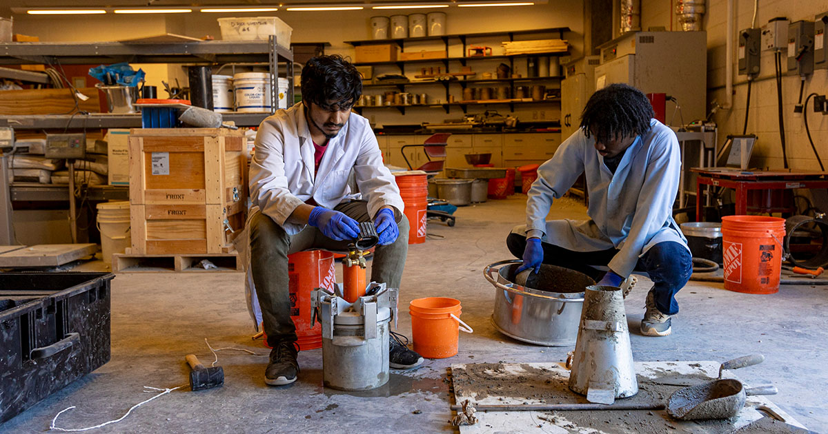 Sazzadul Saykat and Caleb Napper mold their concrete mix.