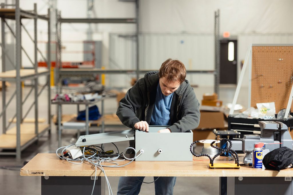 Electrical engineering major Kile Dickey works at the Sparks Innovation Center.