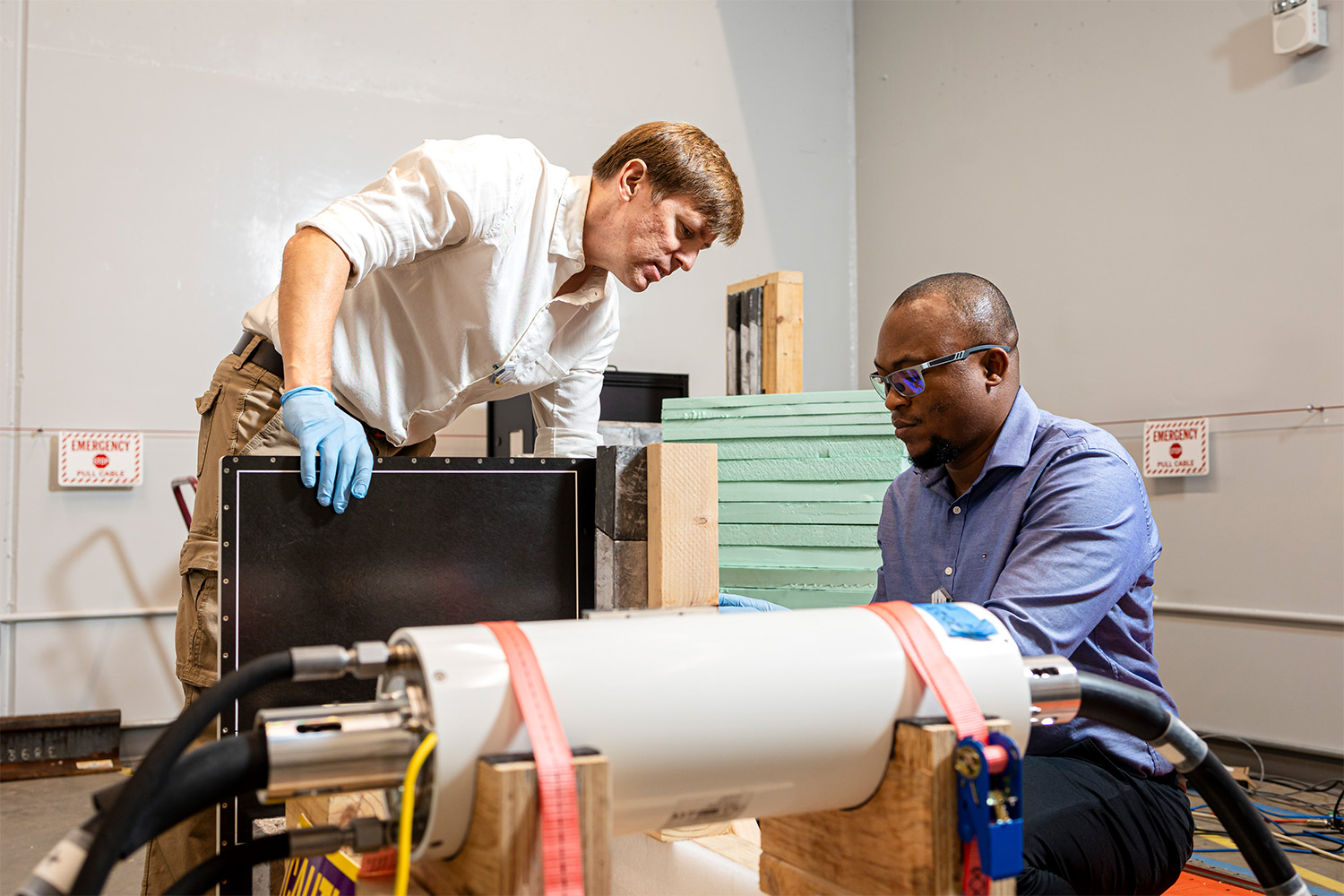 Jason Hayward working with a professor on their consortium project