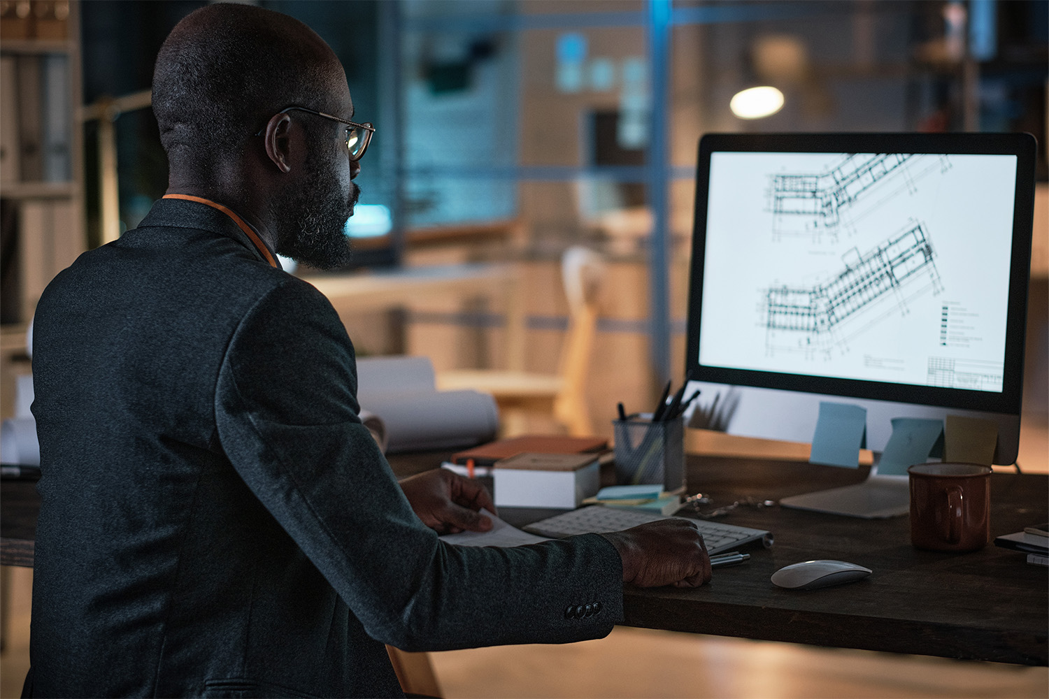 man creating a design on a computer