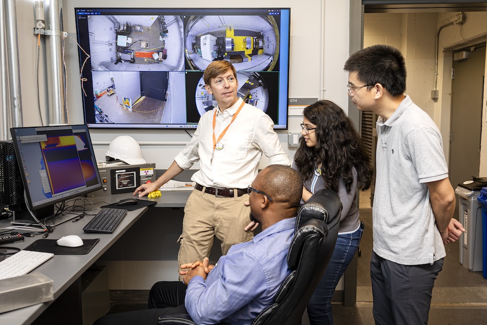 Jason Hayward explaining the neuron source to professors and students