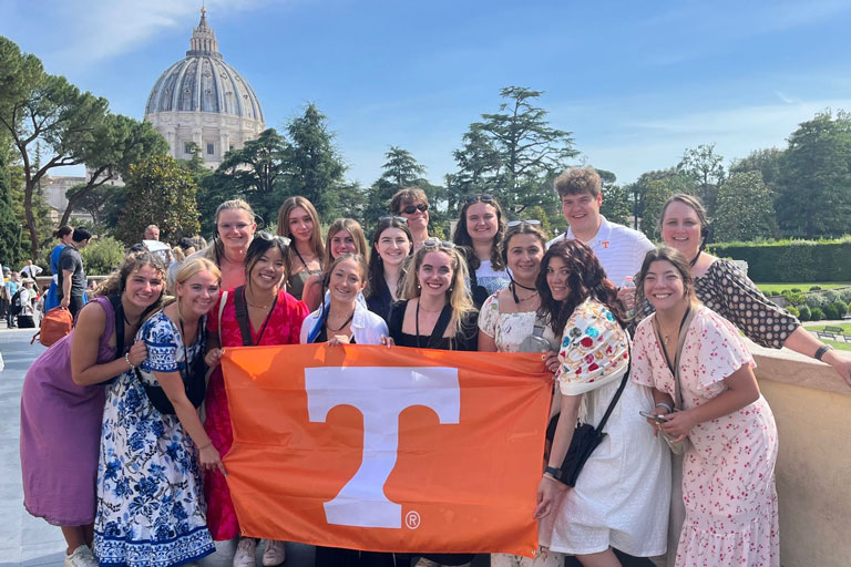 Bailey Tate posing in group photo during study abroad trip