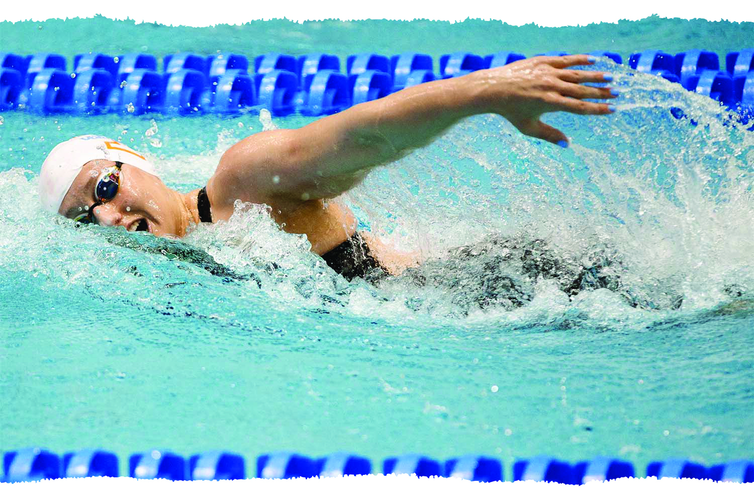 Brooklyn Douthwright swimming in a pool