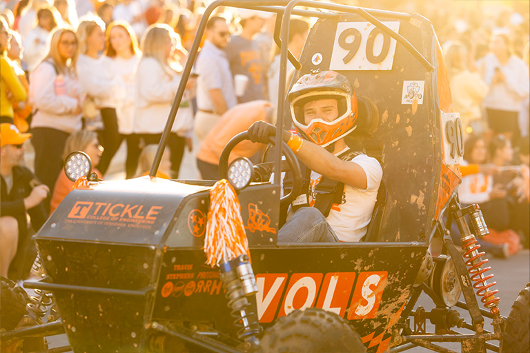 Baja vehicle drives through Homecoming Parade