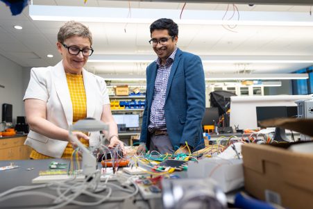 Michela Taufer and Sai Swaminathan in a lab