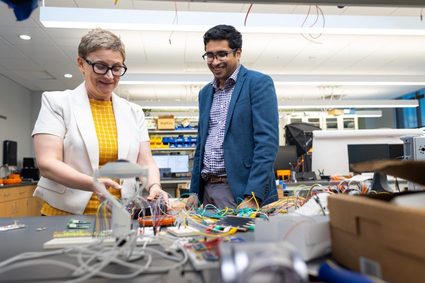 Michela Taufer and Sai Swaminathan in a lab