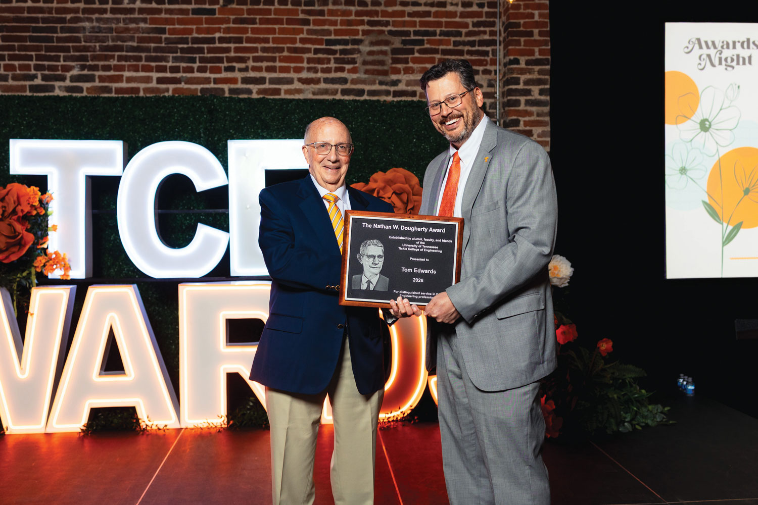 Tom Edwards holding the Nathan W. Dougherty Award plaque with Dean Matthew Mench