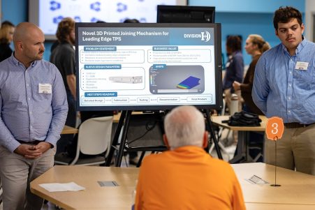 A senior design project team presents their poster titled "Novel 3D Printed Joining Mechanism for Leading Edge TPS"