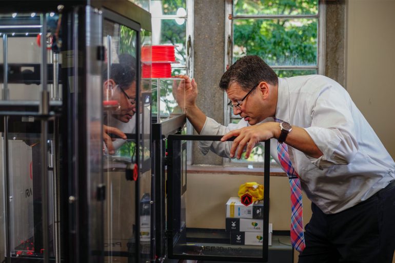 Matthew Mench checks on TEL BOXX in 3d Printer