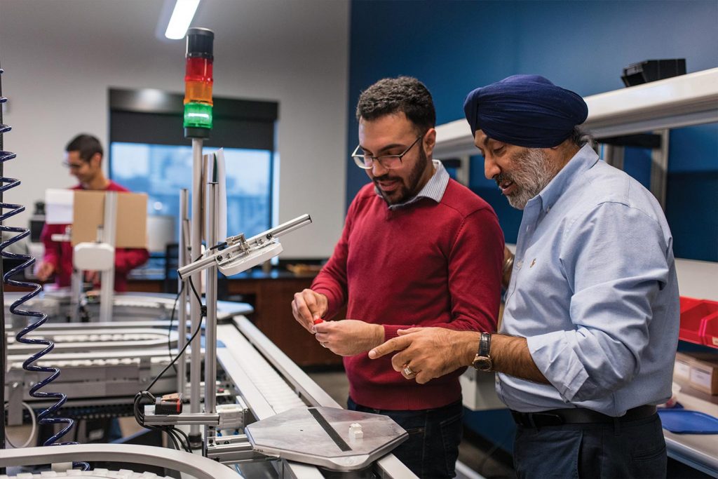 Rupy Sawhney in the Factory Floor Lab with a Student