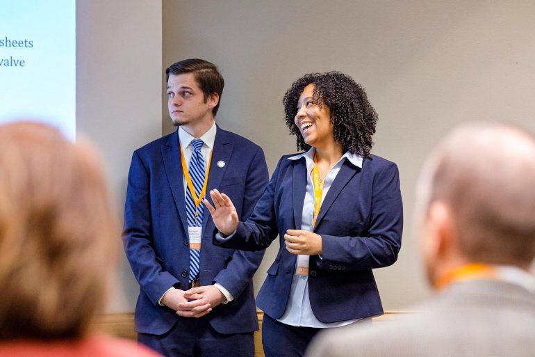 Two students present at the System Level Design Review