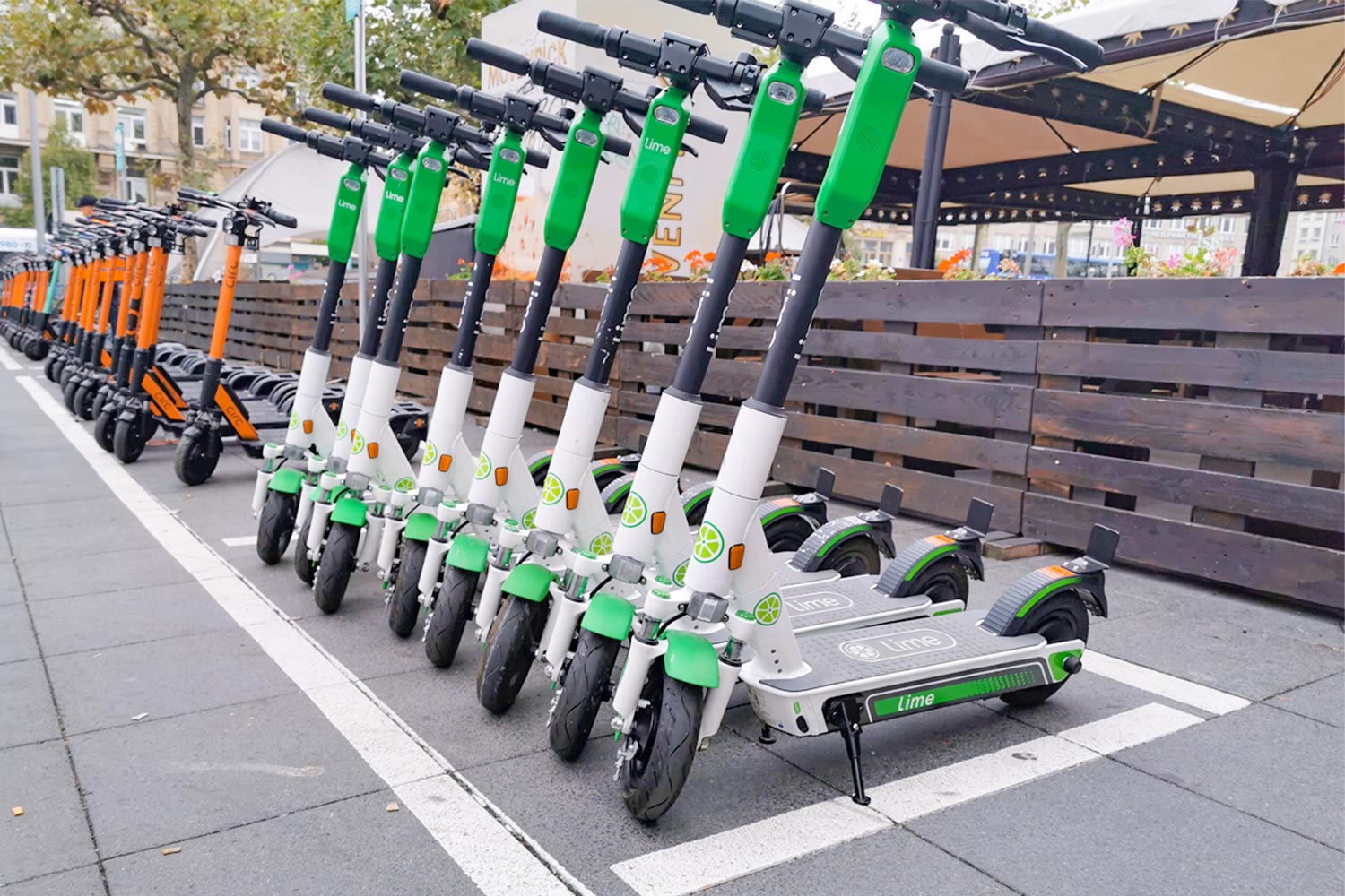 Line of E-Scooters on a City Street