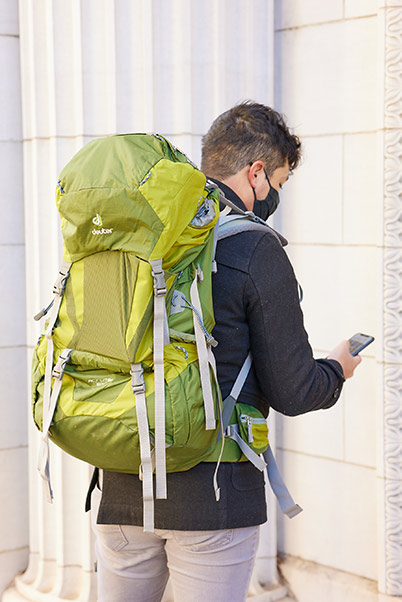 Student tests radioactive detection backpack on building