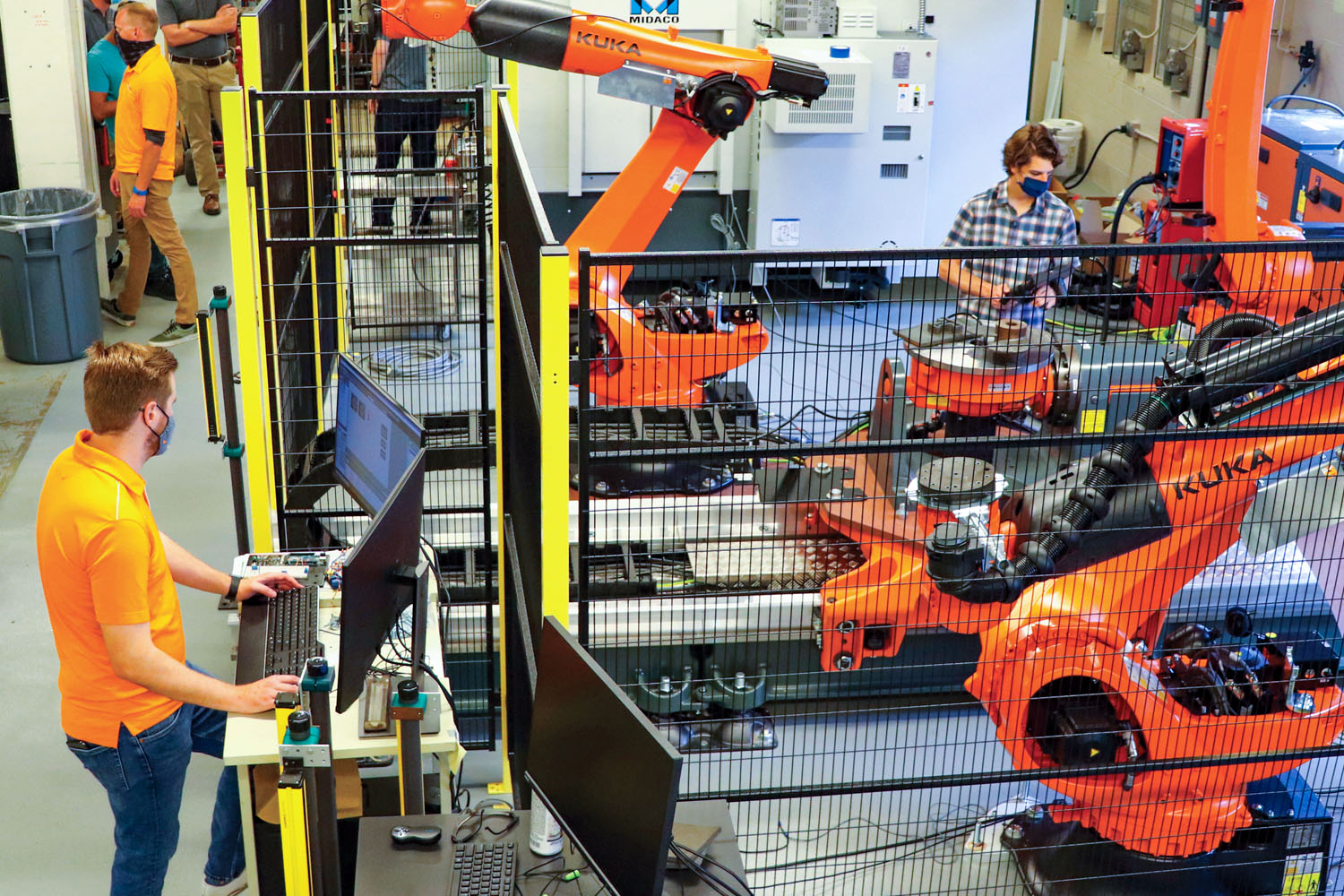 Two students work with robots in Dougherty Lab