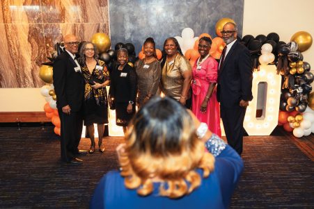Group of people for a photo at 50th anniversary gala dinner