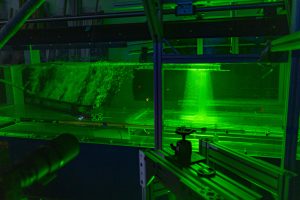 water turbidity machine running a test with a green line shining on it
