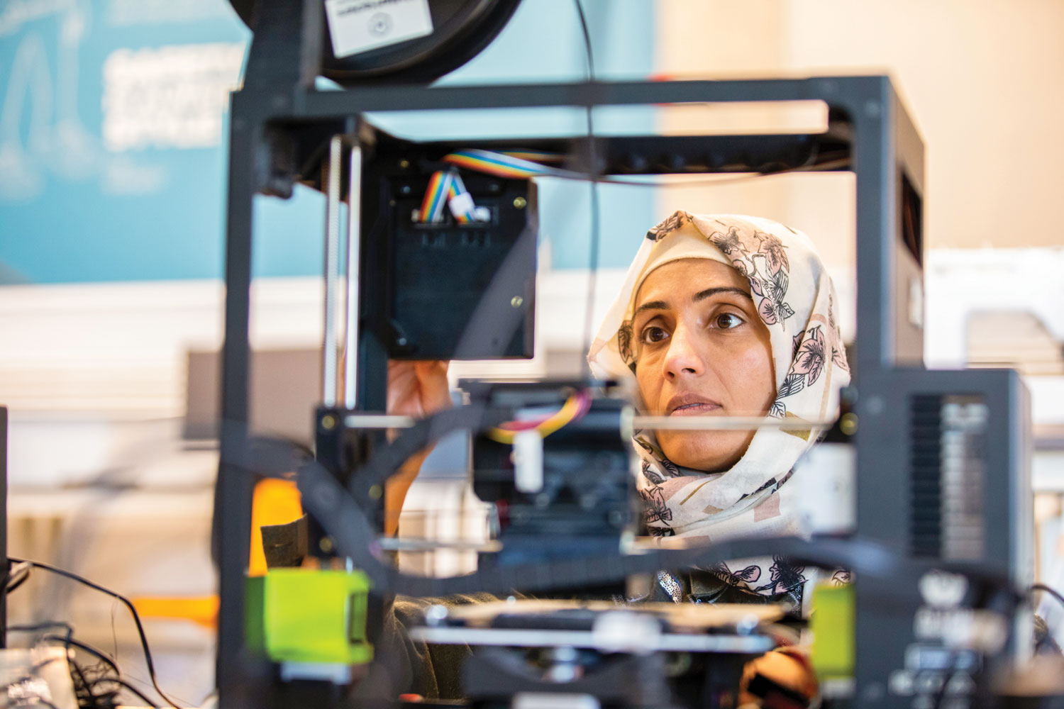 Someone works on a 3D printer inside the Zeanah Engineering Complex