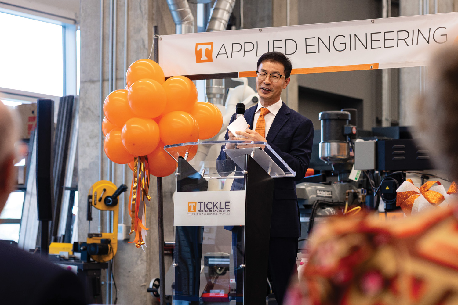 Chulho Yang speaks during ribbon cutting ceremony