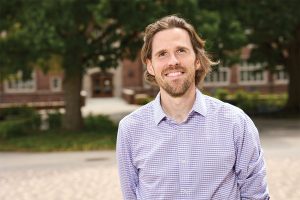Steven Abel in front of Ferris Hall